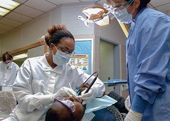 UB Dental Hygiene student with professor